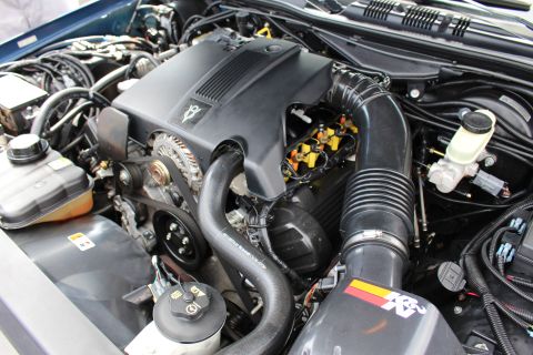Detail of a sedan engine with K&N intake and black cover