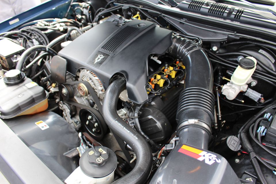 Detail of a sedan engine with K&N intake and black cover