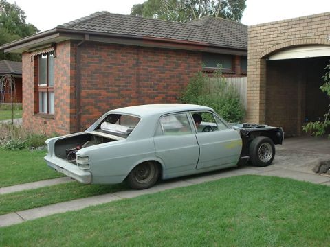 1970 Ford Falcon - This 1970 Ford Falcon is undergoing restoration, with its front end disassembled and trunk open.