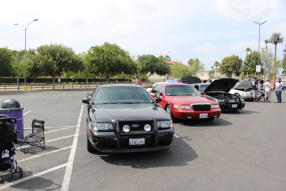 Black Ford police sedan, plate 6TVL491, parked in a show lineup