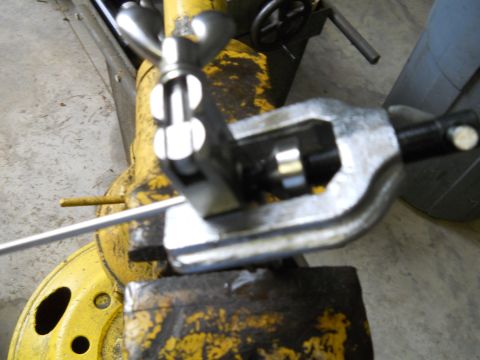 1992 Ford Bronco - A close-up view of a tubing bender tool attached to yellow machinery, with a Supermotors.net watermark visible.