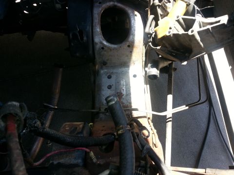 1994 Ford Bronco - Close-up view of engine bay components, including hoses and wiring harnesses.