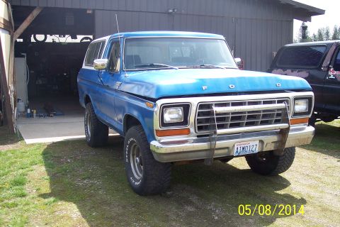 1978 Ford Bronco - This 1978 Ford Bronco is parked in front of a garage, with another vehicle in the background.