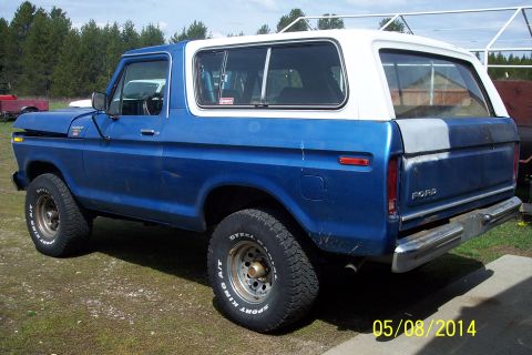 1978 Ford Bronco - This 1978 Ford Bronco is shown from the rear three-quarter angle, with a blue body and white hardtop.