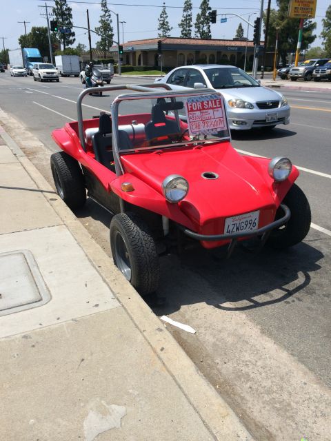 1968 Ford Mustang - A red dune buggy is parked on the side of the road with a for sale sign.