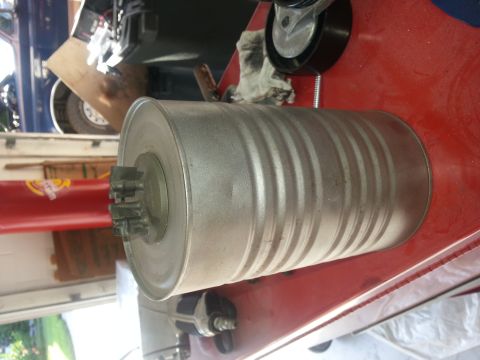 1994 Ford Bronco - Close-up of an exhaust muffler part, likely for a vehicle's engine system.