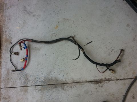 1994 Ford Bronco - Engine wiring harness laid out on a concrete floor.