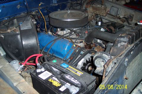 1978 Ford Bronco - Close-up view of a vehicle's engine bay, showing various components and wiring.
