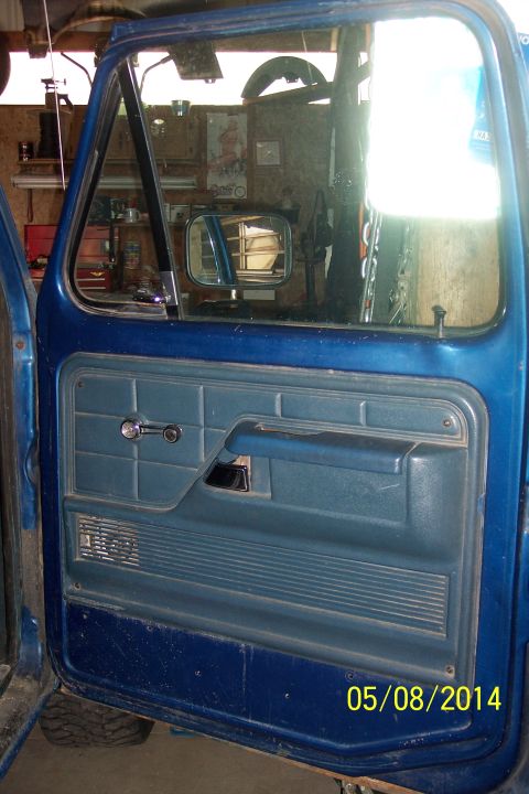 1978 Ford Bronco - The interior of a blue vehicle door shows its upholstery and chrome handle, with a date stamp of 05/08/2014.