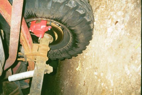 1979 Ford Bronco - Vehicle's rear brake caliper and suspension assembly shown in detail.