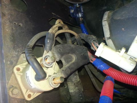 1994 Ford Bronco - Close-up view of a vehicle's starter solenoid and associated wiring, showing electrical connections and a "DIODE SUPPRESSED" label.