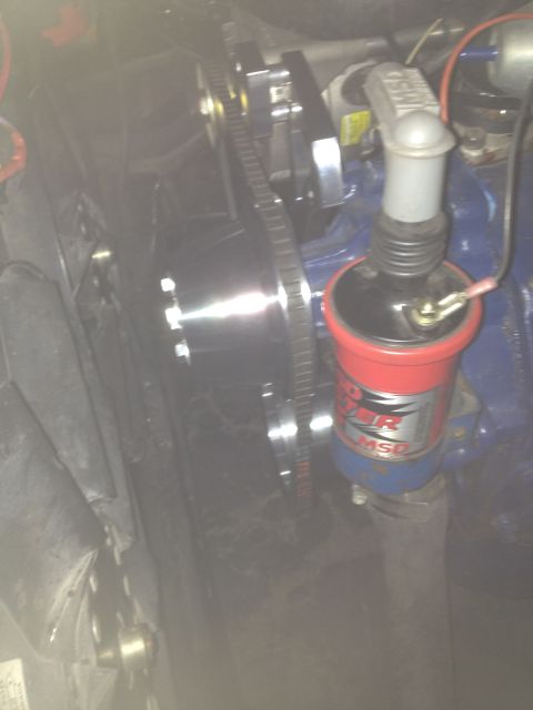 1972 Ford Ranchero - Close-up view of an engine compartment a red MSD ignition coil and a visible pulley system.
