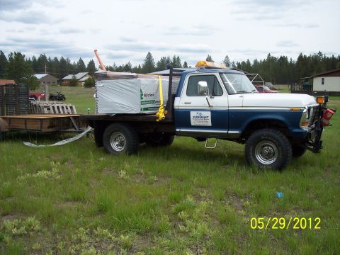 1973 Ford F-250 - This 1973 Ford F-250 is seen towing a trailer loaded with lumber, with a date stamp of 05/29/2012.