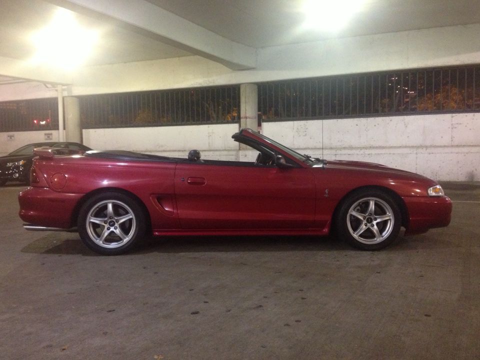 Red 1998 Ford Mustang convertible side view