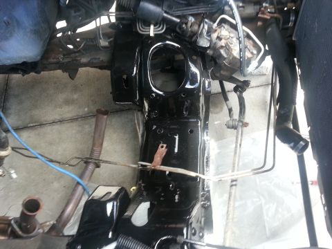 1994 Ford Bronco - Underside view of a vehicle's engine bay, showing various mechanical components and frame structure.