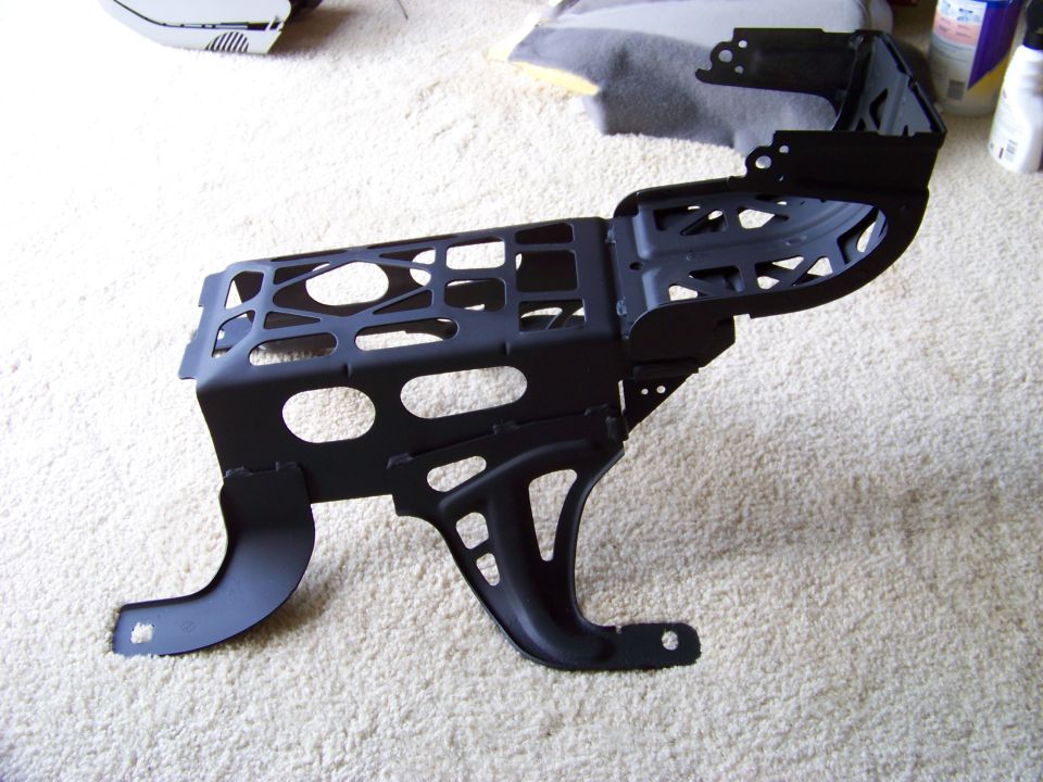 black metal car seat frame on carpet