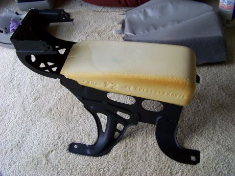 1999 Mercury Grand Marquis - Car seat frame and foam cushion with embossed text on foam, likely a part number.