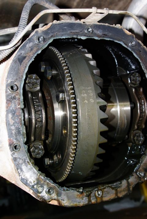 1995 Ford Bronco - The internal components of a vehicle's differential are shown, with visible gears and housing.