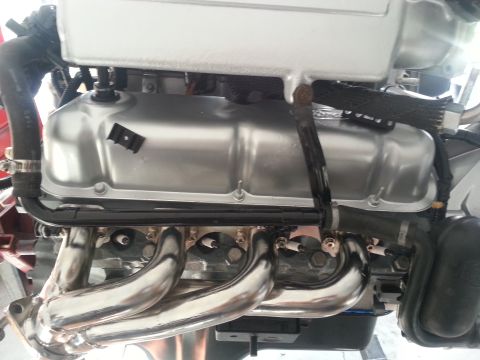 1994 Ford Bronco - Engine components, including valve covers and exhaust manifold, are visible in this close-up shot.