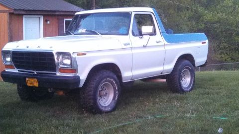 1979 Ford Bronco - This 1978 Ford Bronco is shown from a three-quarter front angle, parked on a grassy area.