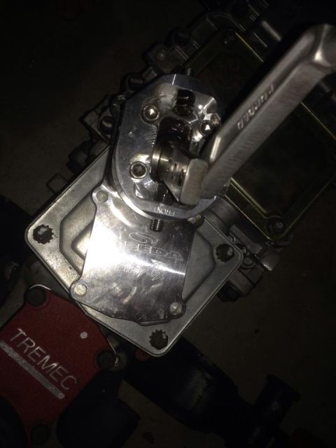 1988 Ford Bronco - Close-up of a SEDA shifter mechanism, branded TREMEC, with a wrench engaged.