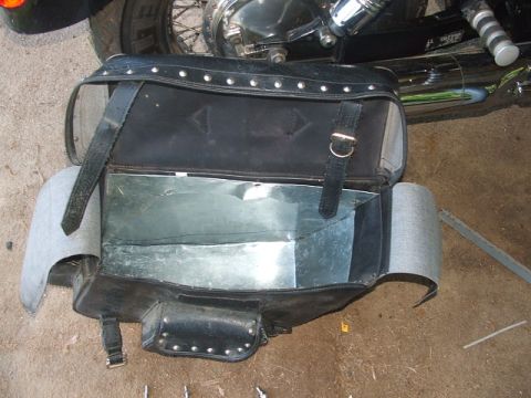 1998 Honda Shadow VT750C - A black leather motorcycle saddlebag with a reinforced metal interior is shown.