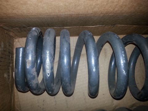 1992 Ford Bronco - Coil springs are shown inside a cardboard box with visible text.
