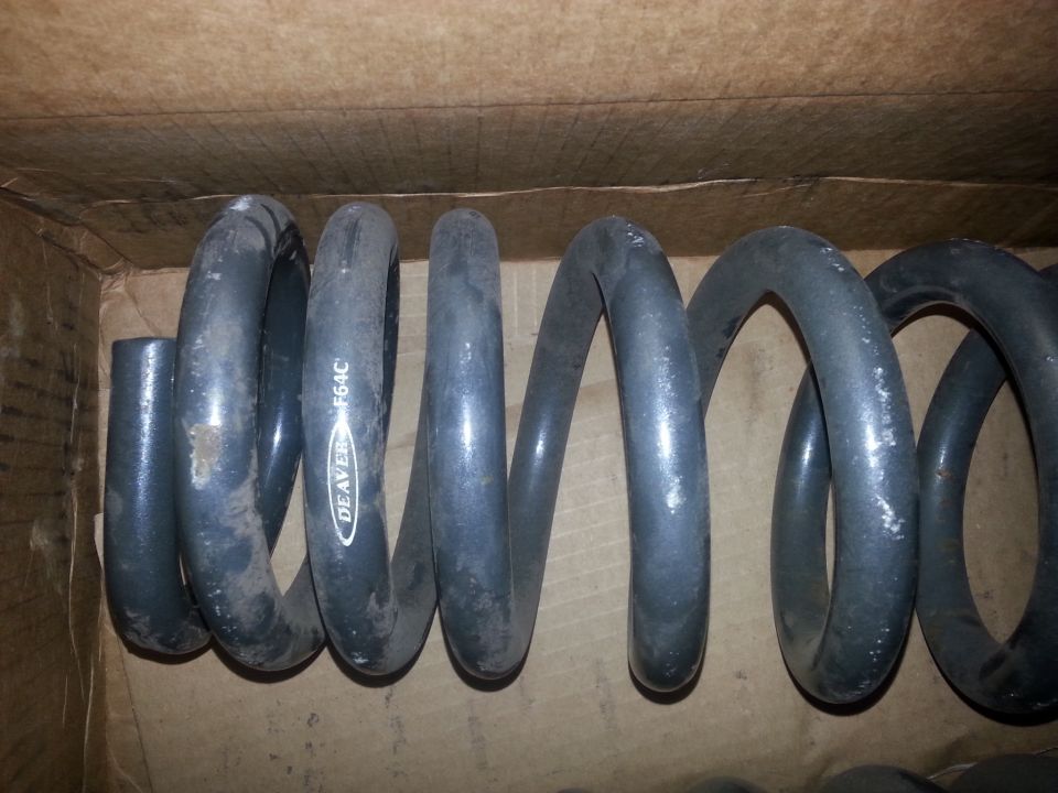 Coil springs with DEAVER F64C text inside a cardboard box
