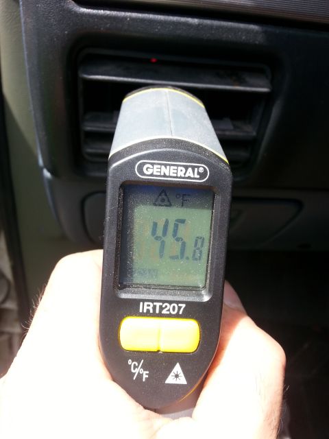 1992 Ford Bronco - Measuring the temperature of air coming from a vehicle's vent with an infrared thermometer.