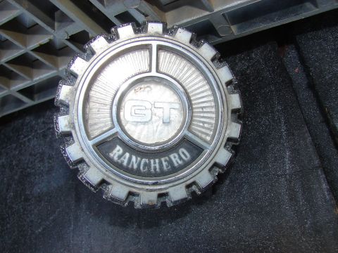 1973 Ford Ranchero - A close-up view of a Ranchero GT emblem, showing the 'GT' and 'RANCHERO' text.