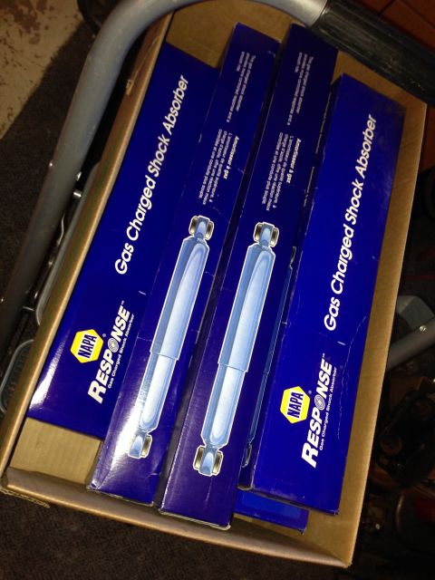 1990 Ford Bronco - Four NAPA Response Gas Charged Shock Absorbers are packaged in blue boxes, ready for installation.