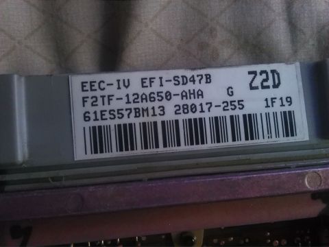 1992 Ford Bronco - This is a close-up view of a Ford EEC-IV EFI computer module, showing its identification and part numbers.
