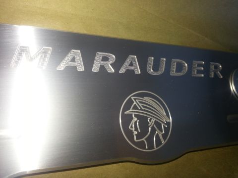 2003 Mercury Marauder - Close-up of the Marauder emblem, the Mercury logo.