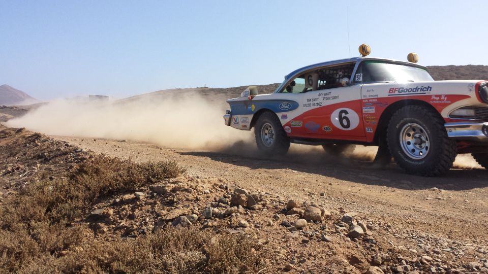 1957 Ford Fairlane 500 rally car kicking up dust