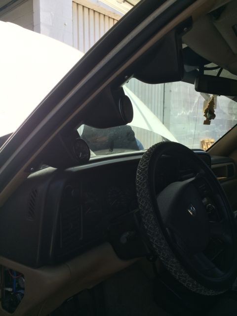 1997 Dodge 3500 - Aftermarket gauges are installed on the A-pillar of this vehicle's interior.