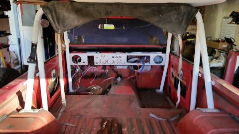 1968 Ford Bronco - Interior view of a 1968 Ford Bronco undergoing restoration, showing the dashboard and roll cage.