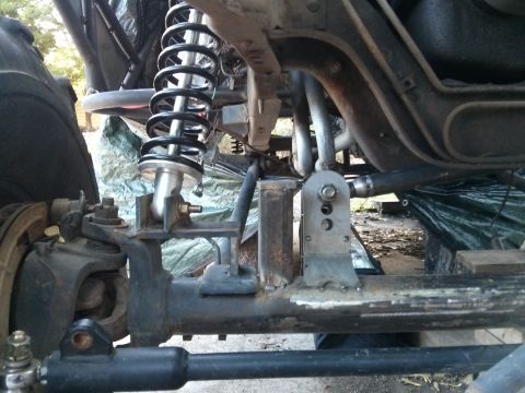 1986 Ford Bronco - Close-up of a custom suspension part, likely for off-road use.