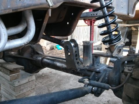 1986 Ford Bronco - The image shows the underside of a vehicle, focusing on the suspension and exhaust system.