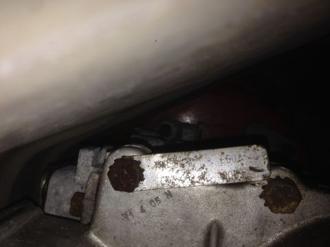 1988 Ford Bronco - Detail of a vehicle component showing stamped identification numbers, possibly from a transmission or drivetrain.