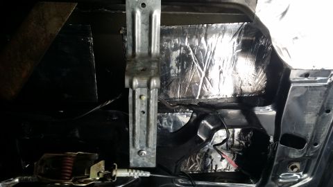 1994 Ford Bronco - Soundproofing material applied to the interior of a car door panel.
