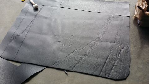1994 Ford Bronco - Cutting sound deadening material for a vehicle project.