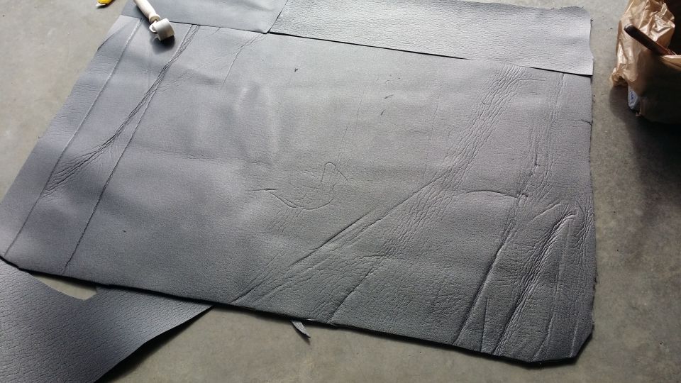 Sound deadening material cut with a roller tool on a concrete floor