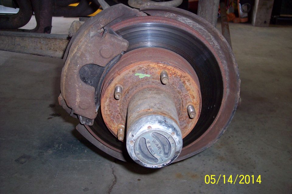 Front wheel hub with Warn locking mechanism and brake rotor