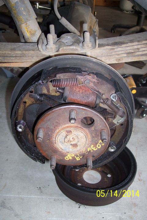 1978 Ford Bronco - Close-up of a vehicle's rear drum brake assembly, showing internal components.