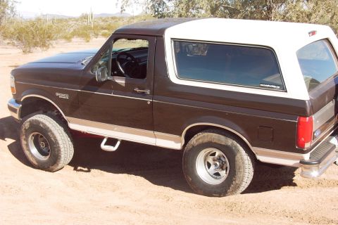 1992 Ford Bronco - This 1992 Ford Bronco is shown from the side in a desert landscape.