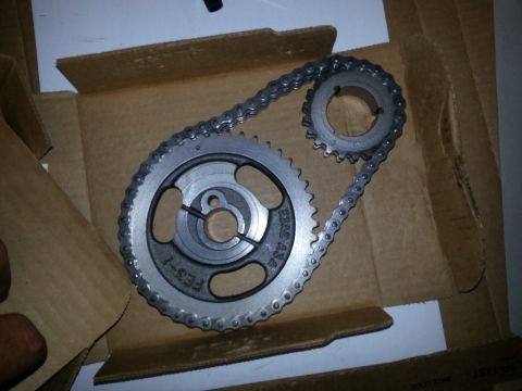 1994 Ford Bronco - A timing chain and gear set is shown, with visible part numbers on the larger gear.