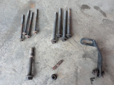 1995 Ford F-150 - Hardware (clockwise from bottom center): Water pump mounting stud/nut Tensioner bolt A/C compressor bolts Bracket to engine block mounting…