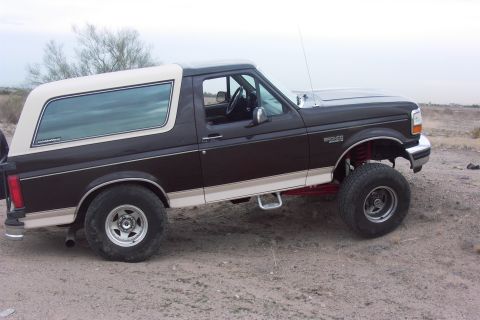 1992 Ford Bronco - This 1992 Ford Bronco is shown with a two-tone paint scheme and lifted suspension.