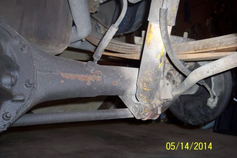 1978 Ford Bronco - This image shows the underside of a vehicle, focusing on the rear axle and suspension system.