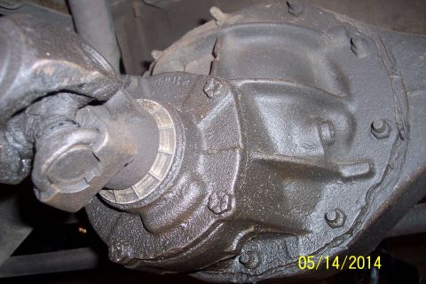 1978 Ford Bronco - Close-up view of a vehicle's differential housing and driveshaft, showing mechanical components.
